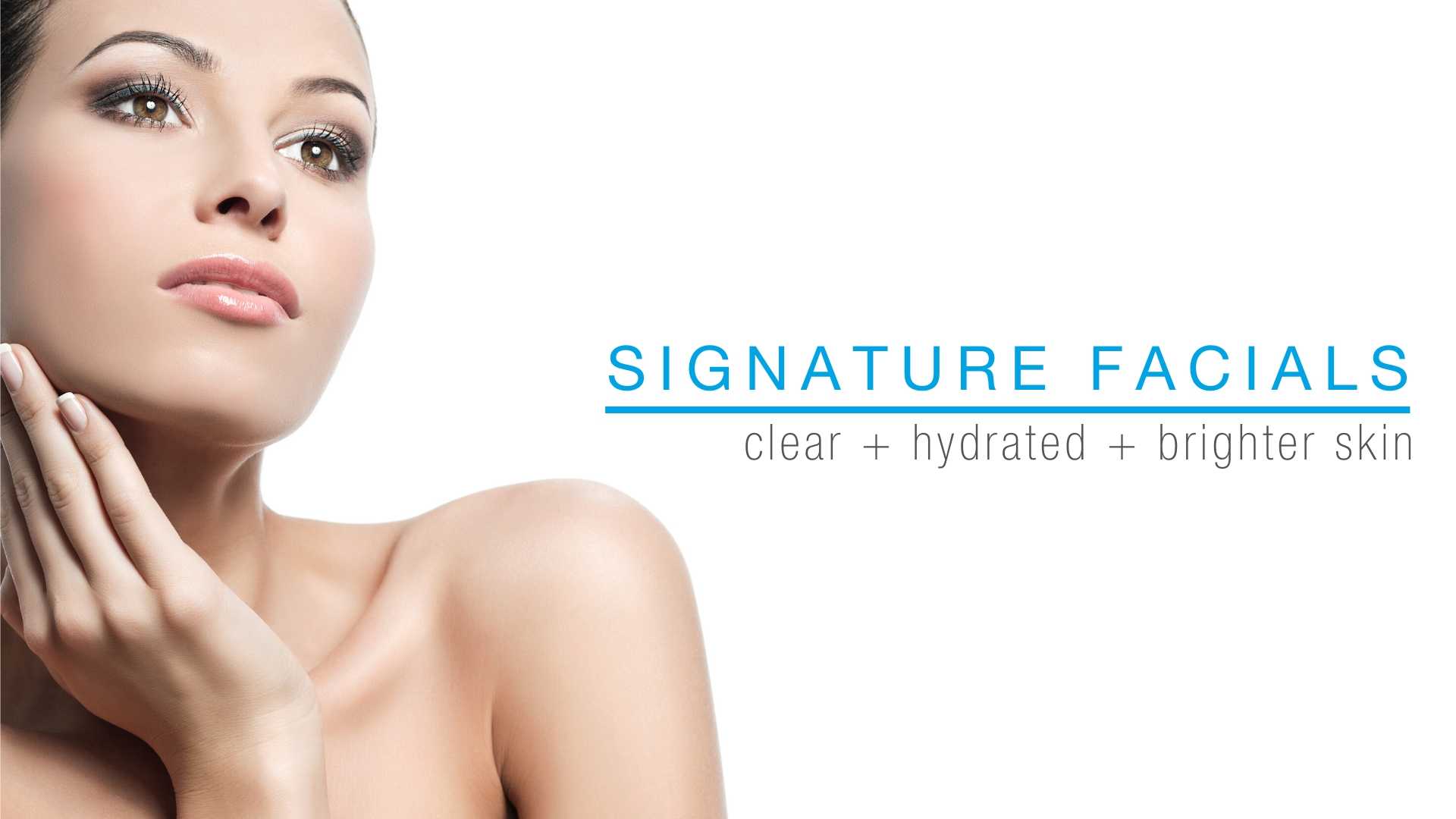 Beautiful woman touches her clear and beaming skin from signature facials.