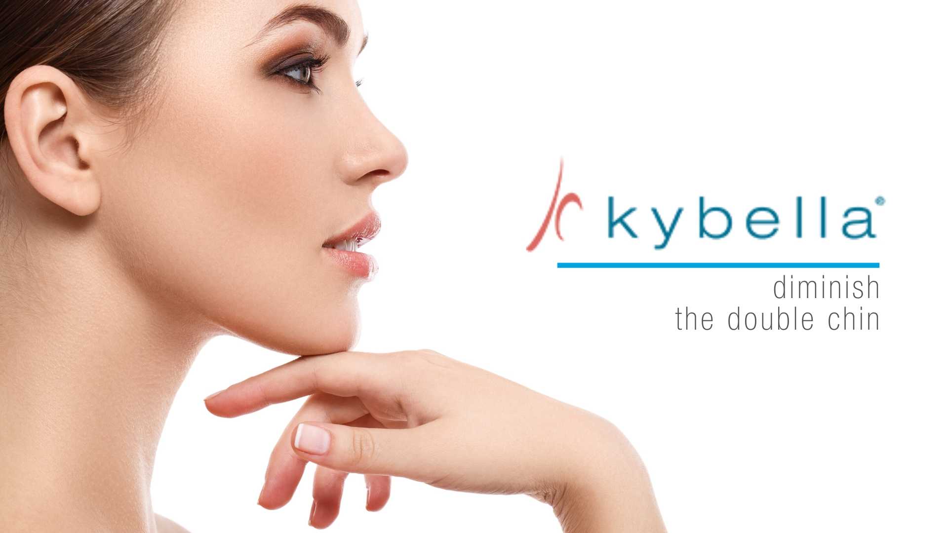 Woman touches her defined chin after kybella treatment.