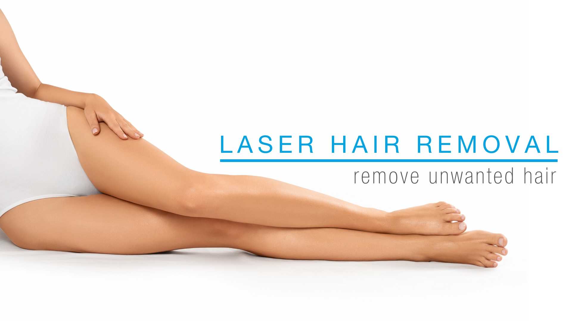 Woman laying down and touching her smooth legs after laser hair removal.